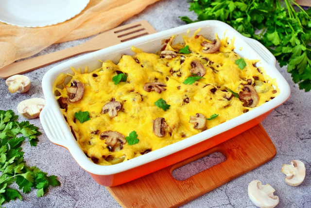 Potatoes with meat, mushrooms and cheese baked in the oven