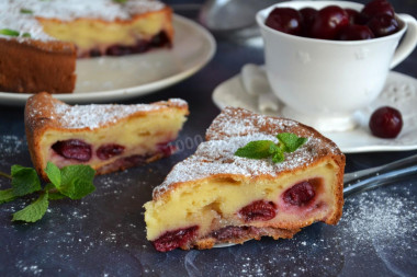 Aspic pie with cherries and sour cream in the oven