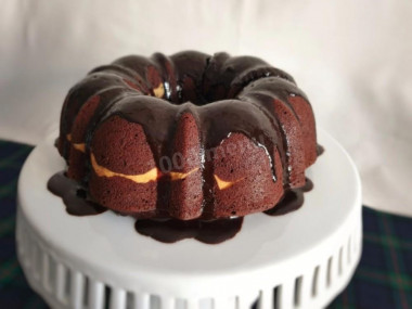 Chocolate cupcake with cocoa and cream cheese in the oven