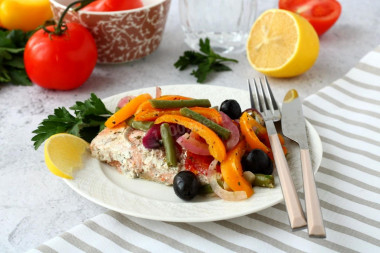 Pink salmon baked in the oven with juicy vegetables