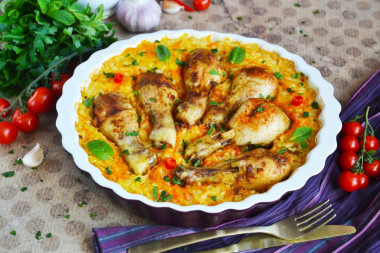 Chicken legs with rice baked in the oven