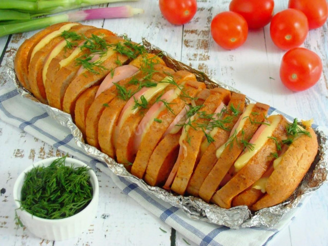 Loaf with cheese and sausage in the oven