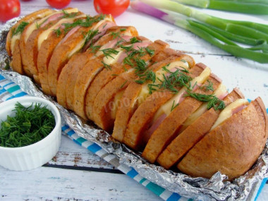 Loaf with cheese and sausage in the oven