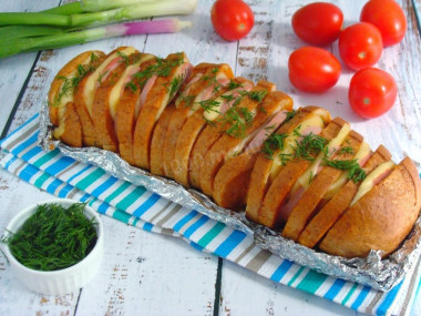 Loaf with cheese and sausage in the oven