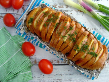 Loaf with cheese and sausage in the oven