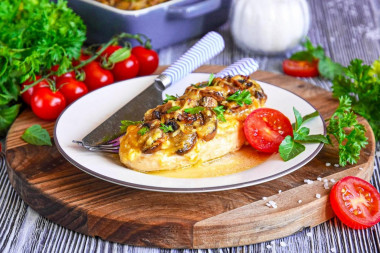 Chicken fillet with mushrooms and cheese in the oven