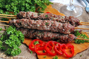 Kebab on skewers in the minced meat oven