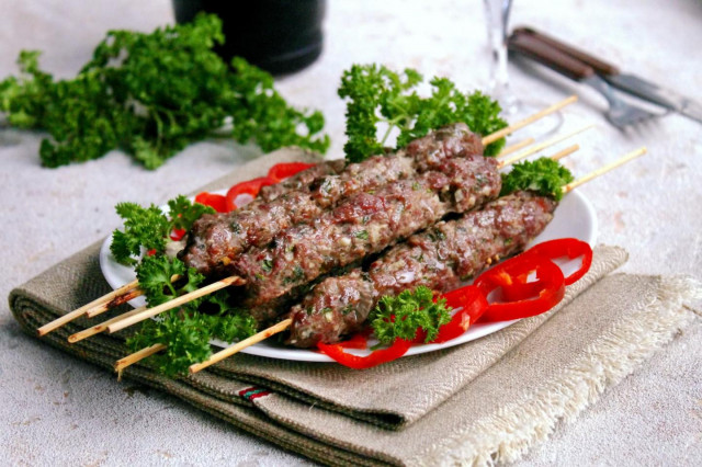 Kebab on skewers in the minced meat oven