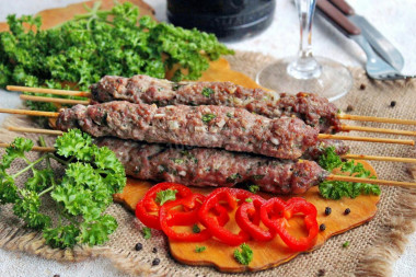 Kebab on skewers in the minced meat oven