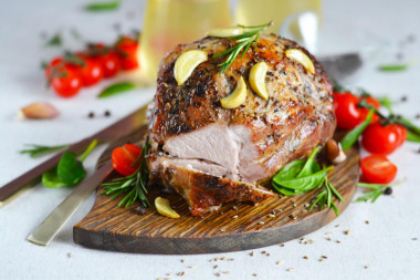 Baked pork shoulder in the oven in foil