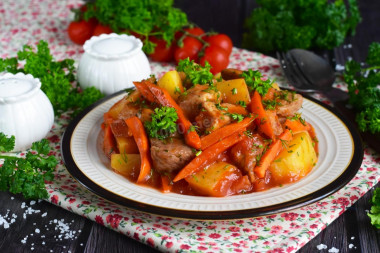 Potatoes with meat in a duck house stewed in the oven