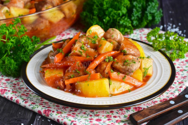 Potatoes with meat in a duck house stewed in the oven