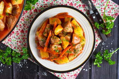 Potatoes with meat in a duck house stewed in the oven