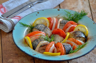 Mackerel with tomatoes baked in the oven with onions