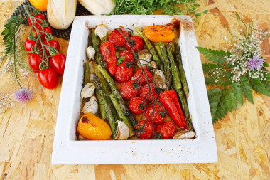 Fresh green asparagus in the oven with vegetables