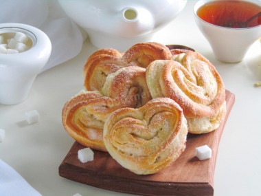 Pies with sugar from yeast dough in the oven