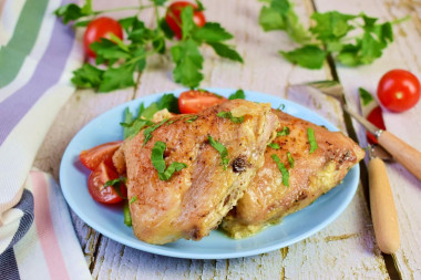 Chicken thighs in mayonnaise with garlic in the oven