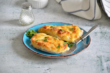 Chicken breast with pineapple and cheese in the oven