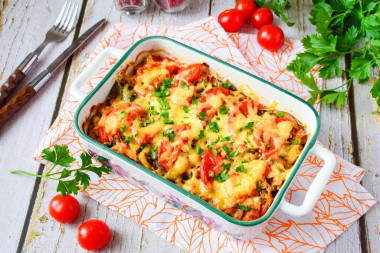 Potato casserole with minced meat and mushrooms in the oven