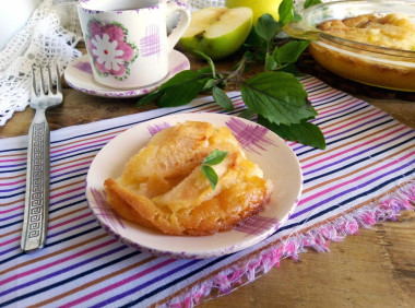 Pie with apples on sour cream in the oven