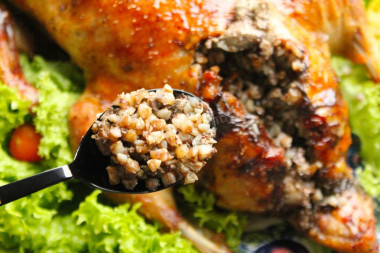 Duck stuffed with buckwheat in the oven