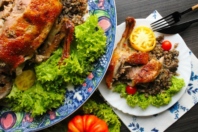 Duck stuffed with buckwheat in the oven