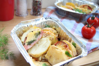 Potatoes with sausage and cheese in the oven