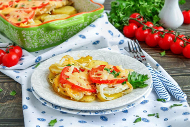 Potatoes in the oven with mayonnaise and tomatoes