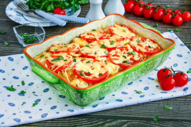 Potatoes in the oven with mayonnaise and tomatoes