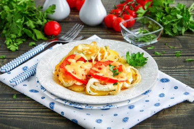 Potatoes in the oven with mayonnaise and tomatoes