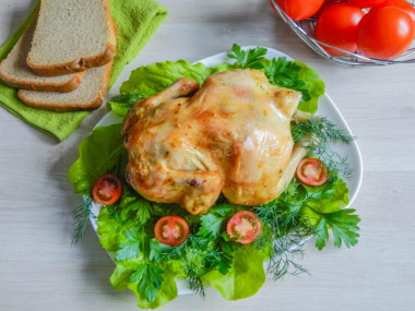 Whole chicken in the oven on a jar