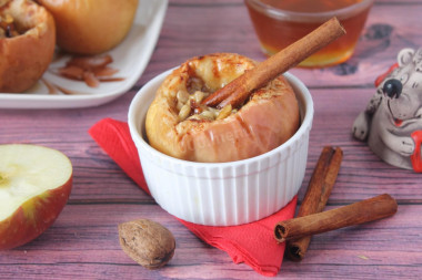 Baked apples with sugar and cinnamon in the oven