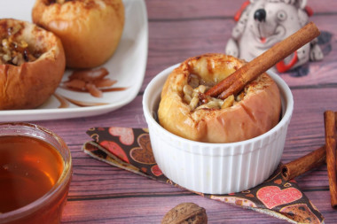 Baked apples with sugar and cinnamon in the oven