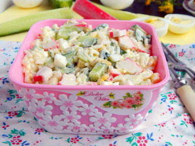 Salad with rice, crab sticks, cucumber and corn