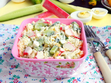 Salad with rice, crab sticks, cucumber and corn