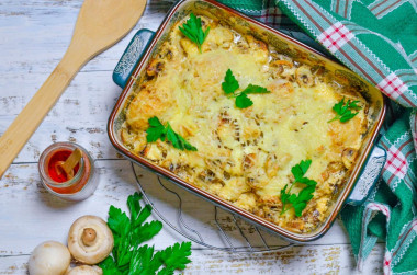 Chicken legs with mushrooms in the oven