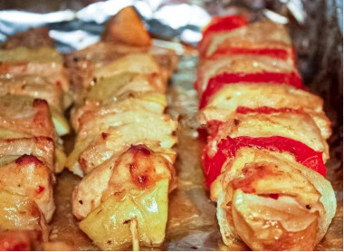 Pork kebab on skewers in the oven