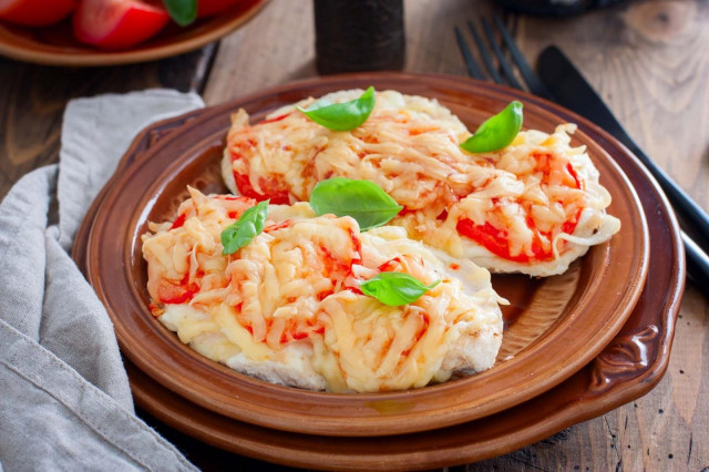 Chop breast with tomatoes and cheese