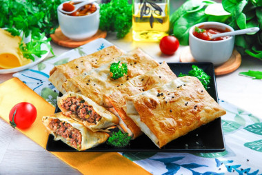 Lavash with minced meat and cheese in the oven