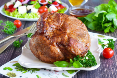 Pork neck in foil baked in the oven piece