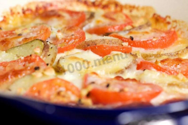 Potatoes meat mushrooms tomatoes in the oven in French