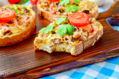 Hot sandwiches with mushrooms and cheese in the oven