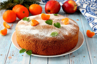 Charlotte with tangerines and apples in the oven