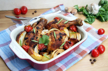 Chicken drumsticks with vegetables in the oven