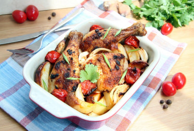 Chicken drumsticks with vegetables in the oven