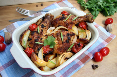 Chicken drumsticks with vegetables in the oven