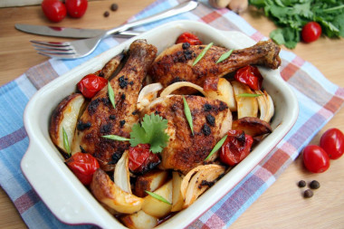 Chicken drumsticks with vegetables in the oven