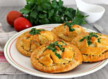 Chicken and potato pies in the oven