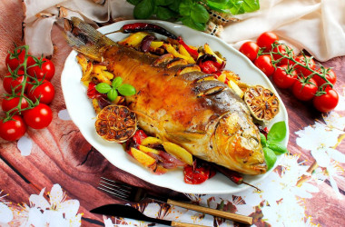 Carp baked in the oven with vegetables