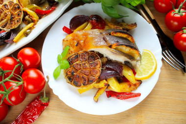 Carp baked in the oven with vegetables